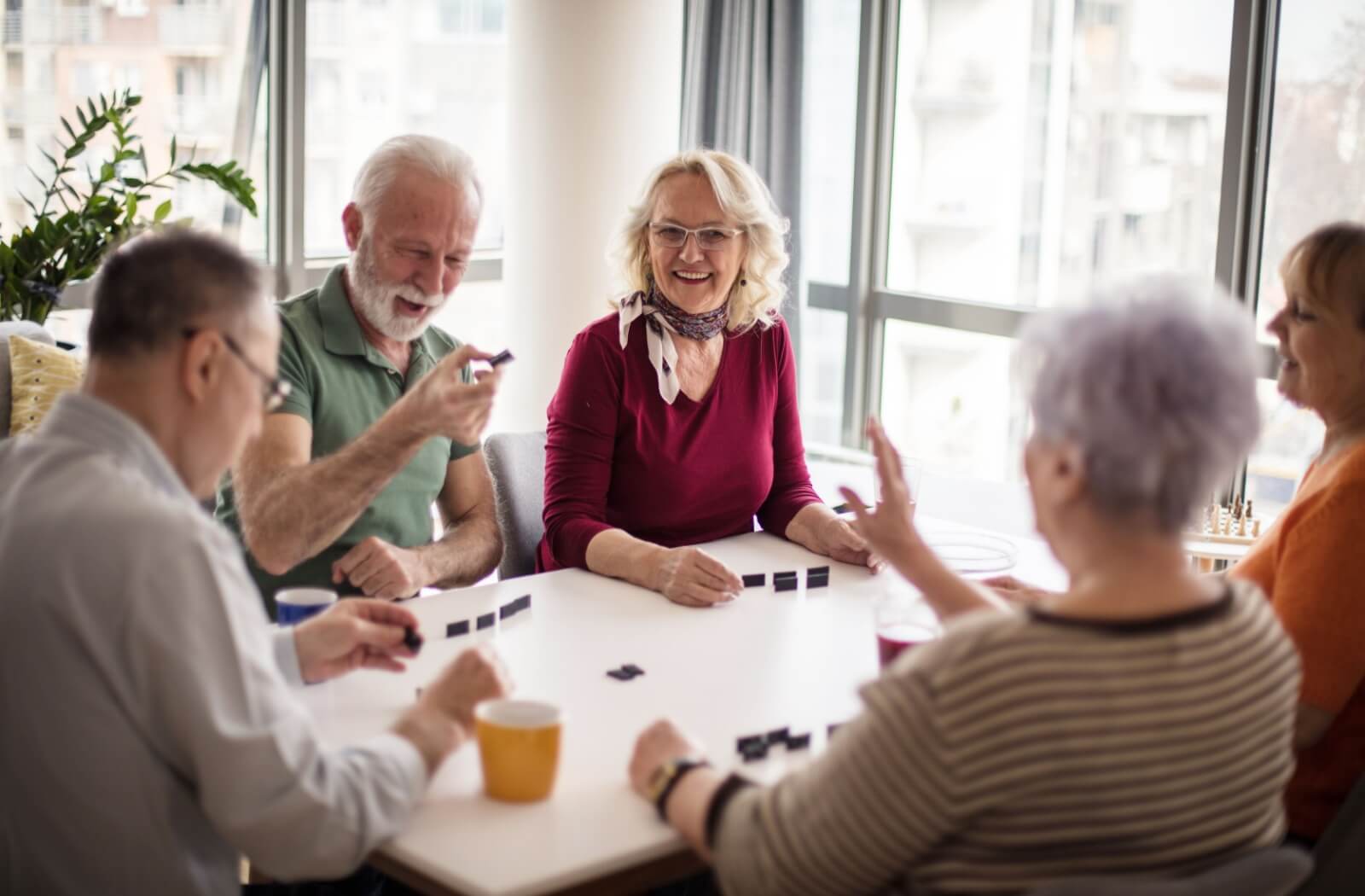 Some seniors have a visit together with their loved ones, combining to play a game.
